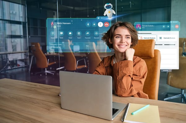 A woman working on her laptop, Dstny ConnectMe, VoipCube and AI assistant helping her
