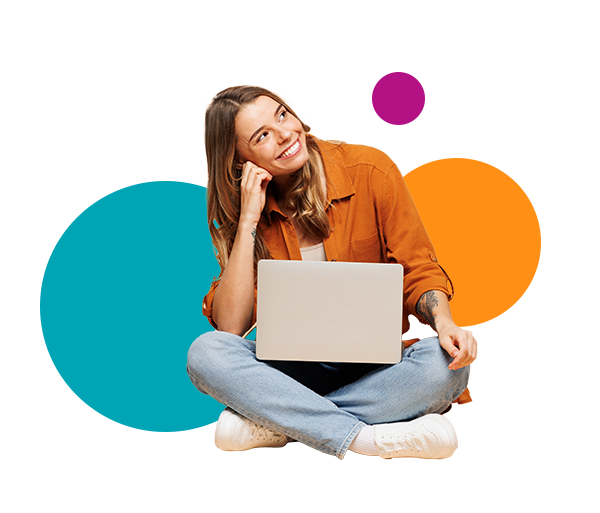 A woman sitting on the floor with a laptop in her lap. 