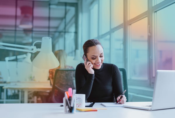 woman_in_office_talking_on_phone