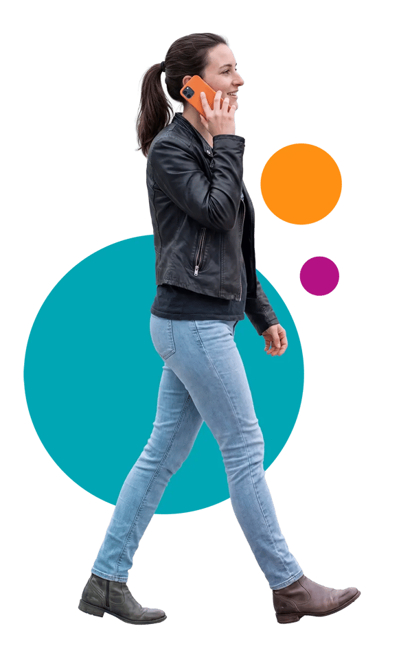 A woman walking, talking on the phone