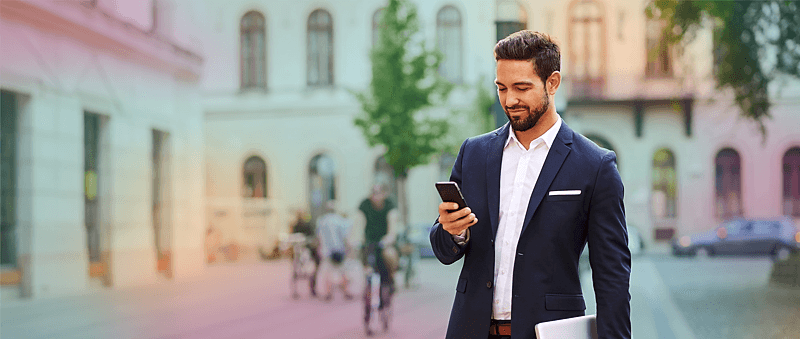 man_looking_at_phone_oldcity