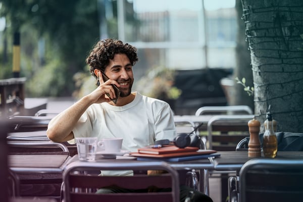 outside-restaurant-man-latino-mobile-headset-phonecall-dstnyjpg