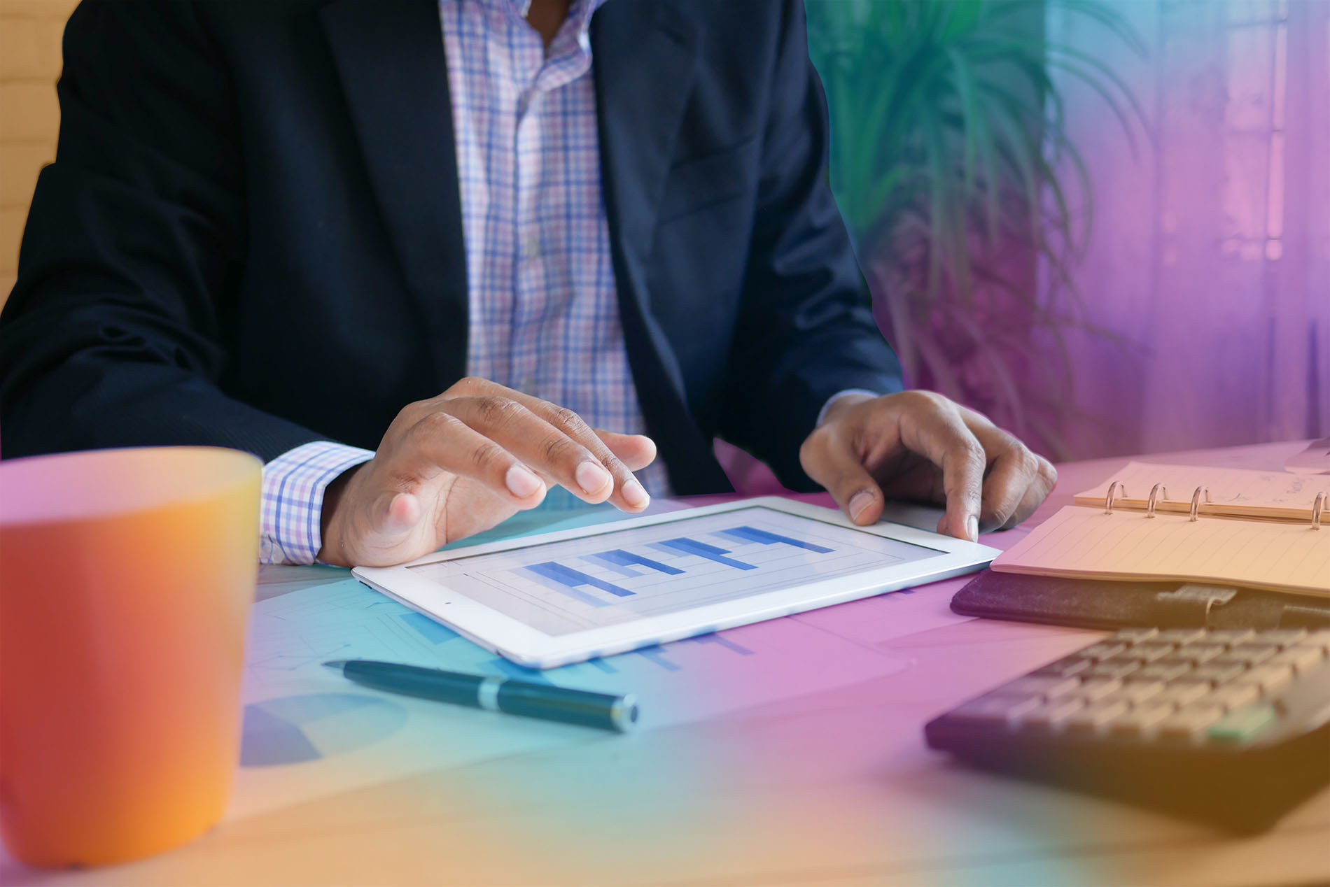 Man using analytics on tablet